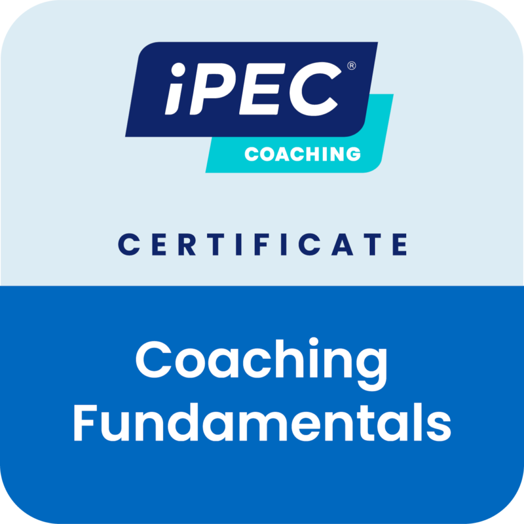 A blue badge with the words coaching fundamentals in it.